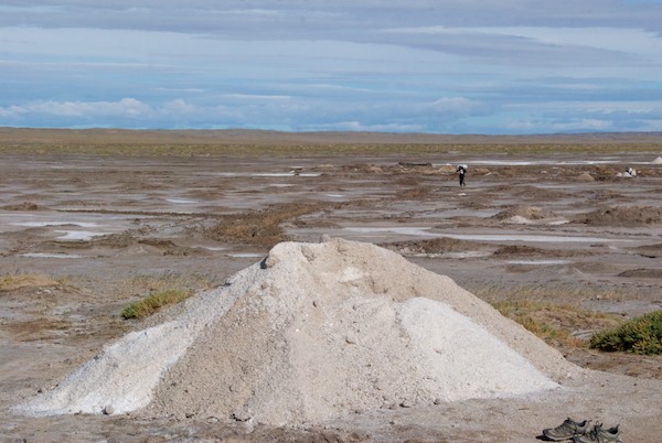 The salt deposit, with harvested salt ready to be bagged up.