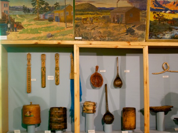 It was hard to get back far enough to get everything in, but here is one of the display cases with everyday utensils. There was art all around the room, too.